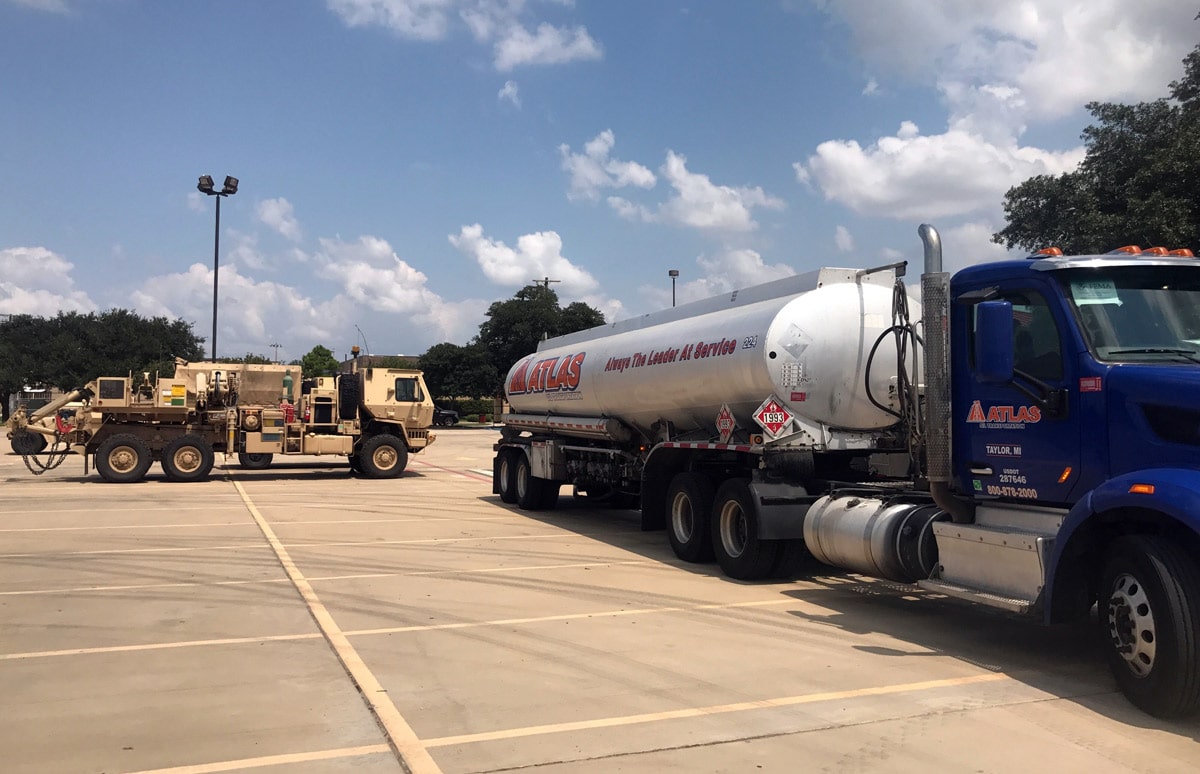 An Atlas truck fuels military vehicles for Hurricane Harvey emergency response.